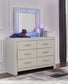 Zyniden Queen Upholstered Panel Bed with Mirrored Dresser, Chest and Nightstand